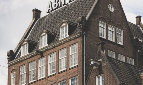 a large brick building with a clock on top of it