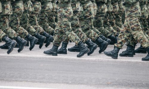 men in green and brown camouflage uniform