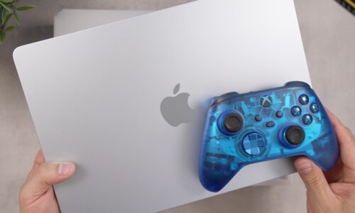 Transparent blue game controller on a laptop
