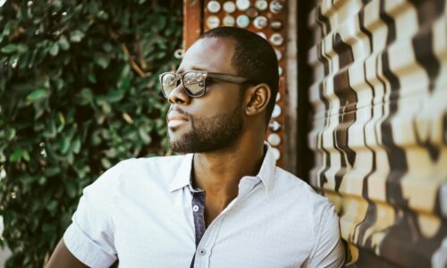 man in white button up shirt wearing black framed eyeglasses