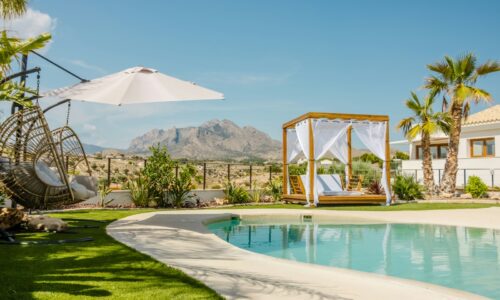 Resort pool area with mountains in the background.