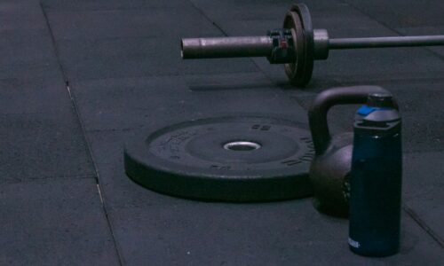 A gym equipment laying on the ground on a sidewalk