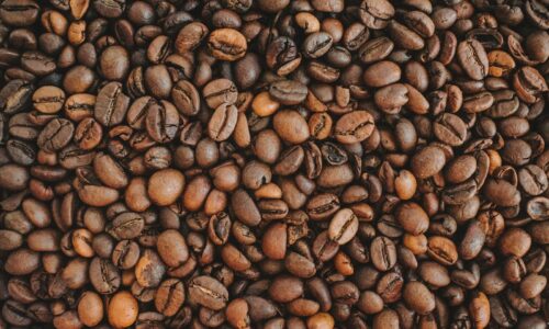brown coffee beans on brown wooden table