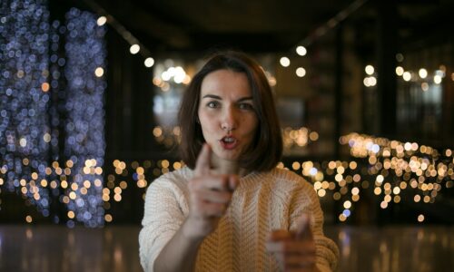 a woman making a funny face with her finger