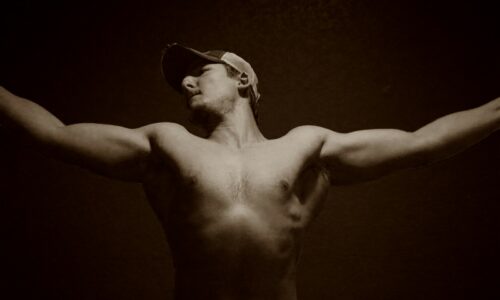 A man with his arms outstretched in the air