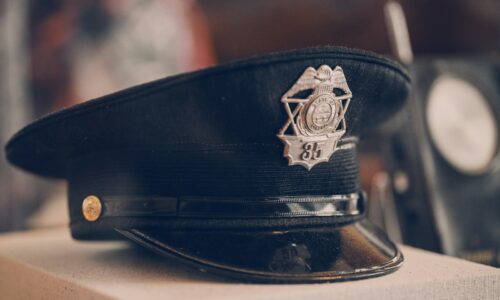 a police hat sitting on top of a box