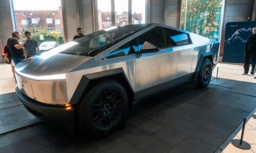 A futuristic car on display in a building