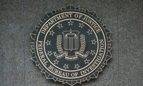 the seal of the department of justice on a wall