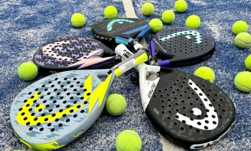 tennis rackets and balls on a tennis court