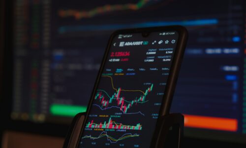 black android smartphone on brown wooden table